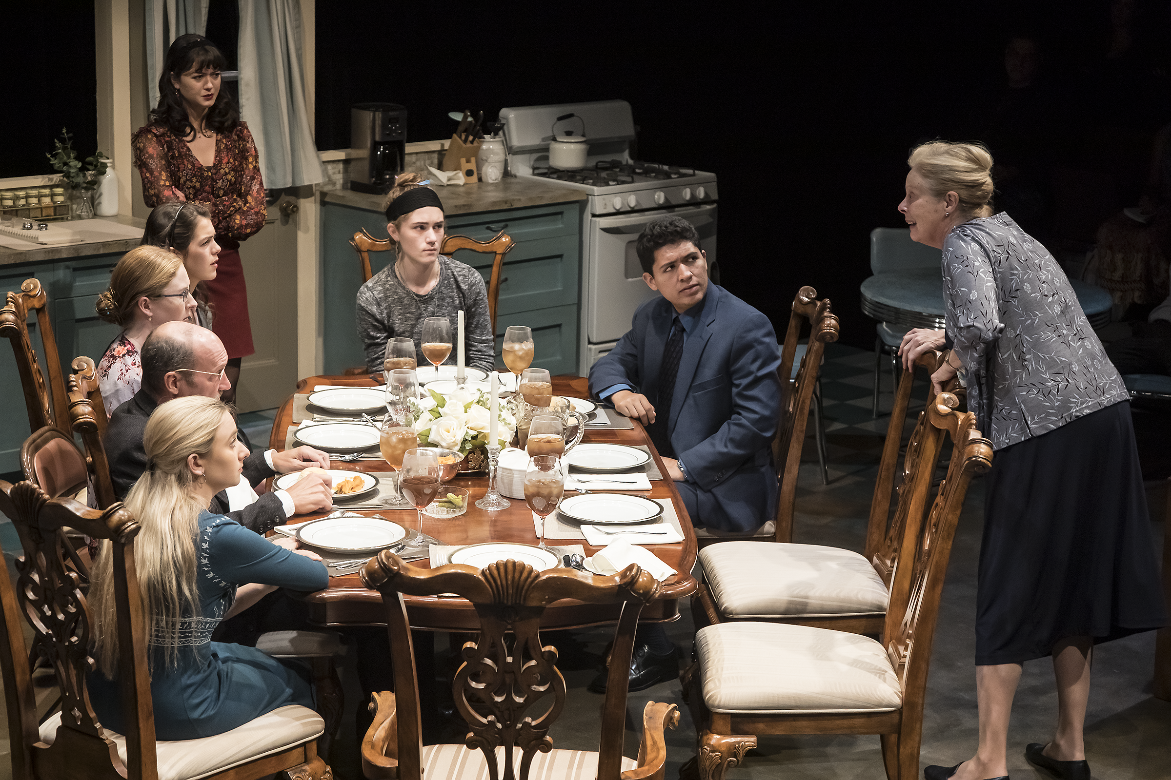 scene at the dining room table with all cast members