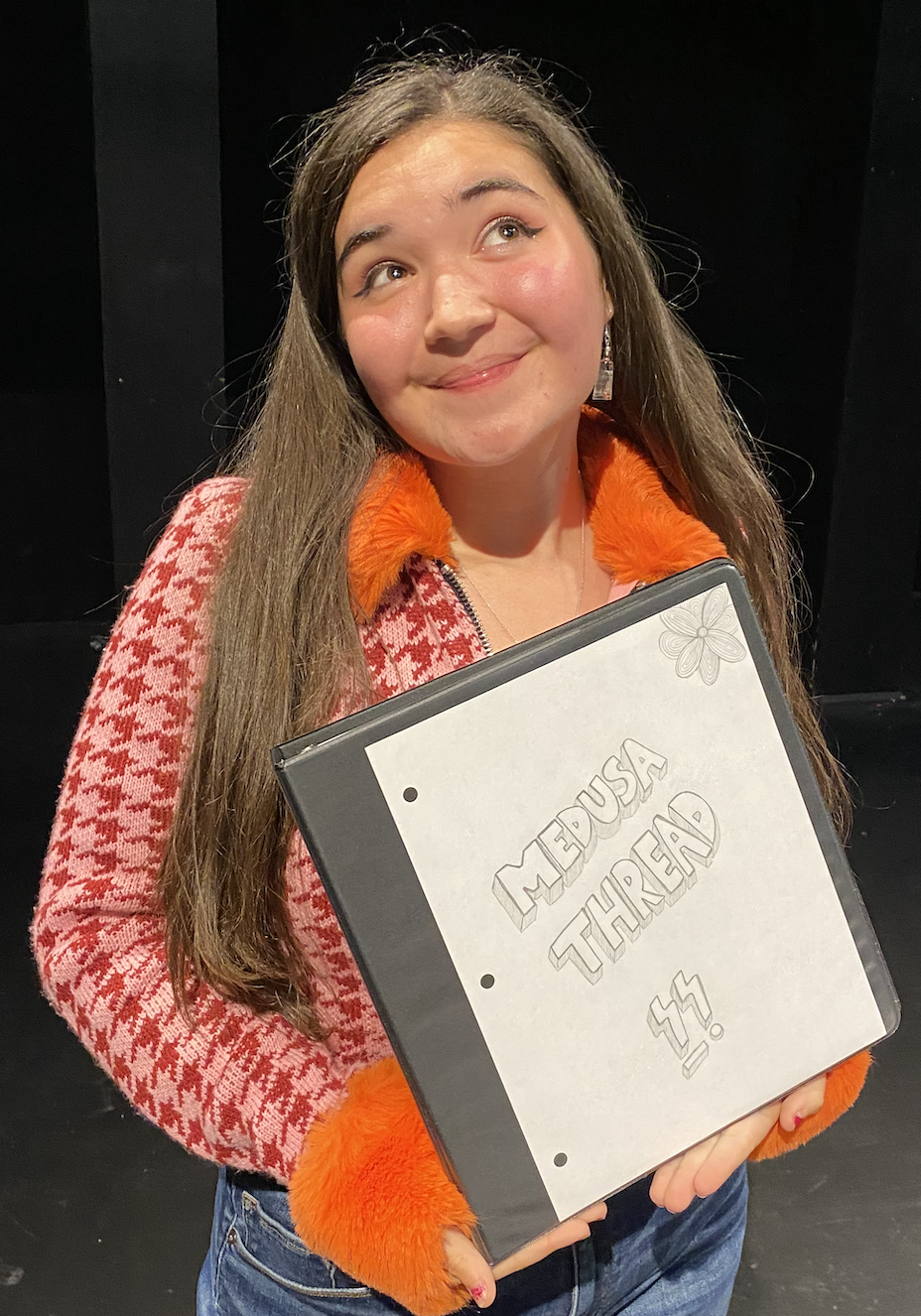 Lola Barak holding a notebook