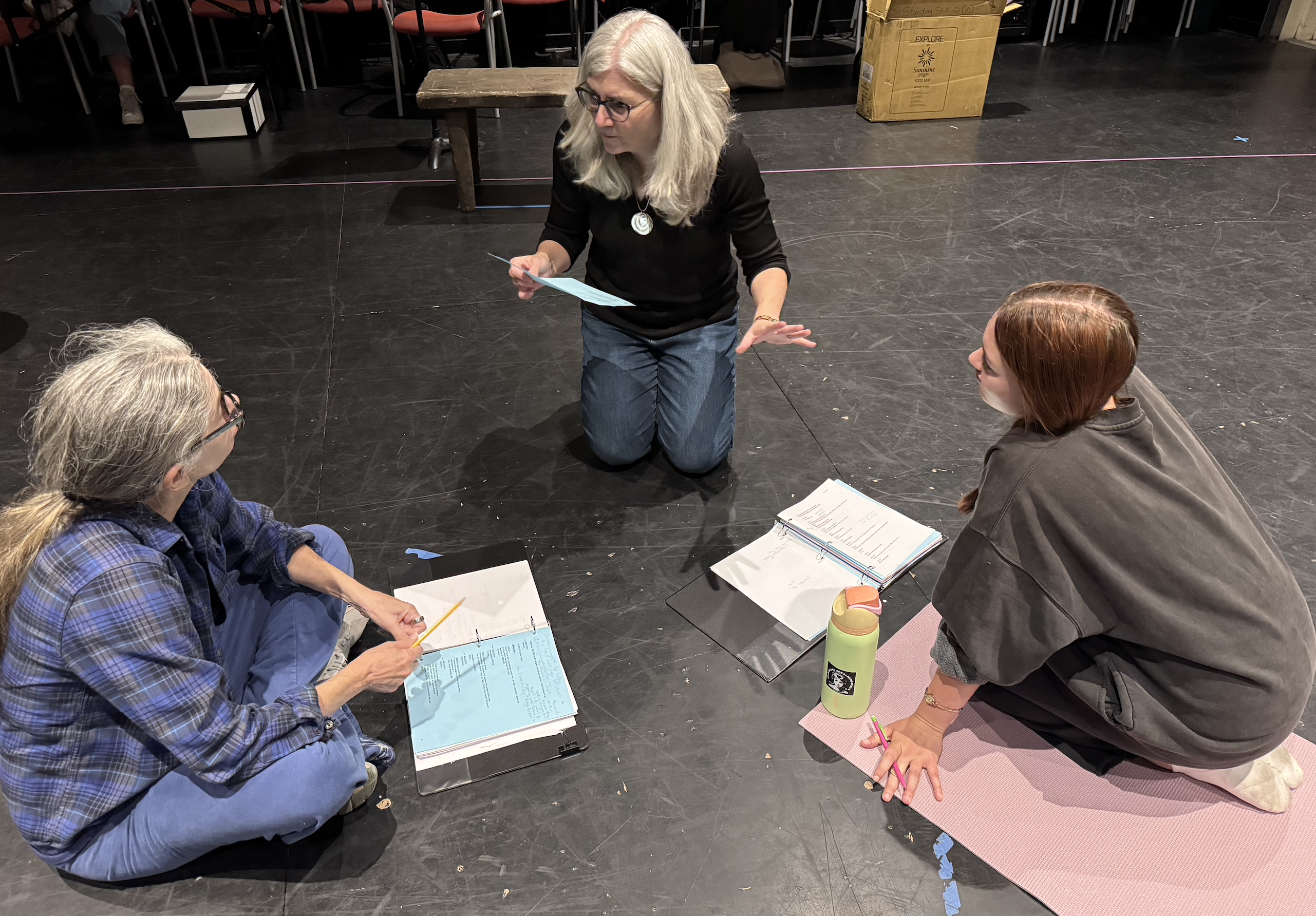Risa Brainin directing actors in rehearsal